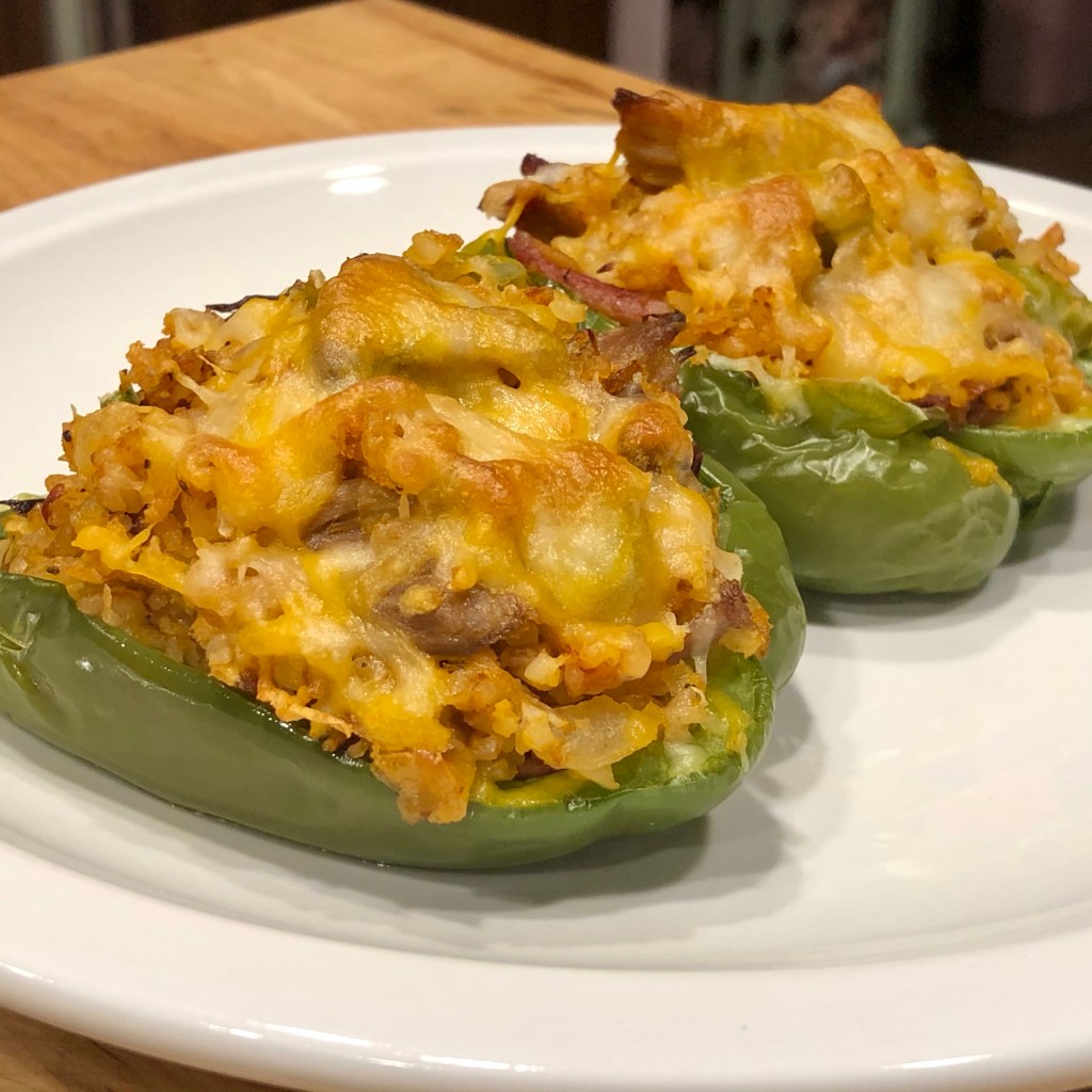 Two BBQ Pork Stuffed Peppers on a plate